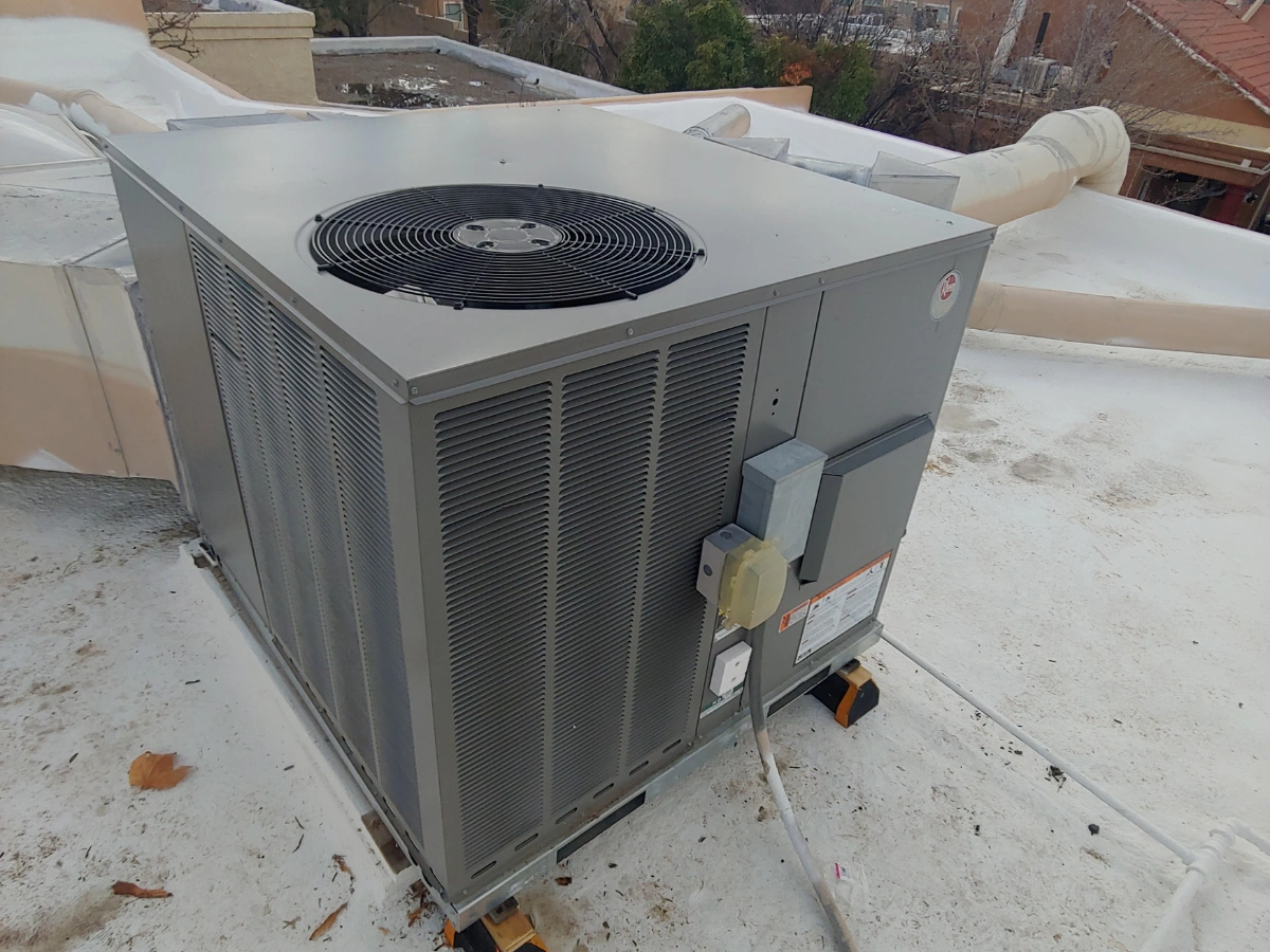 Servicing a Rooftop package unit in Albuquerque, NM on a desert home